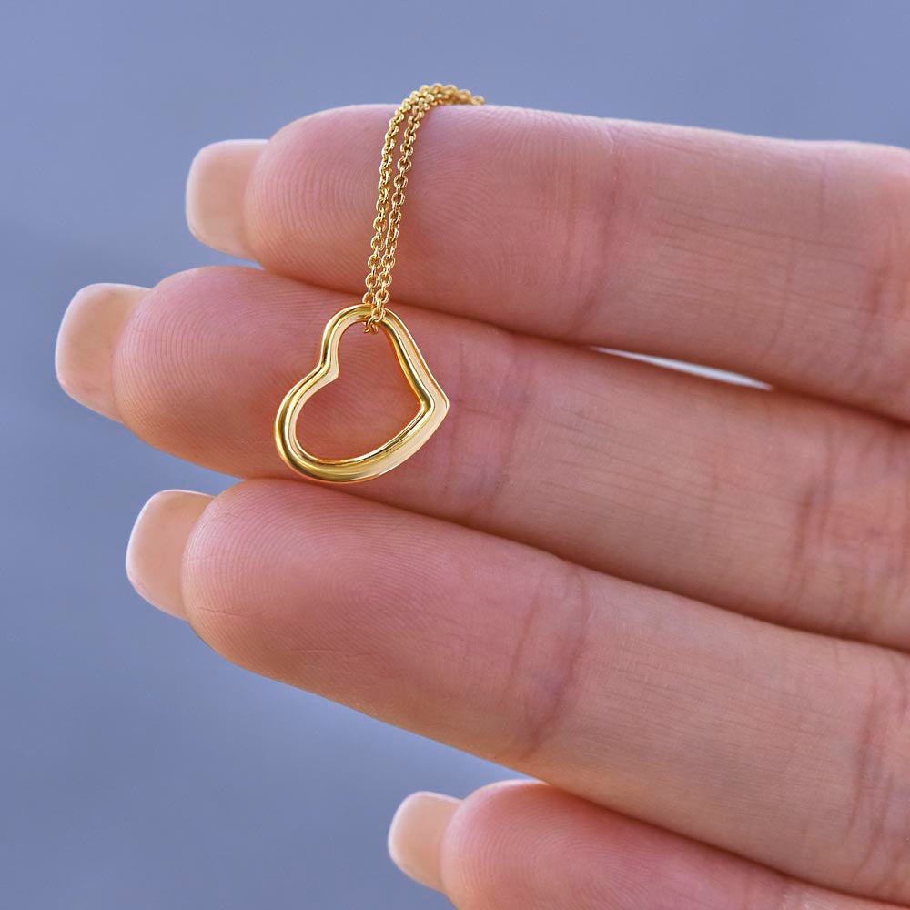 heart pendant necklace close up in hand