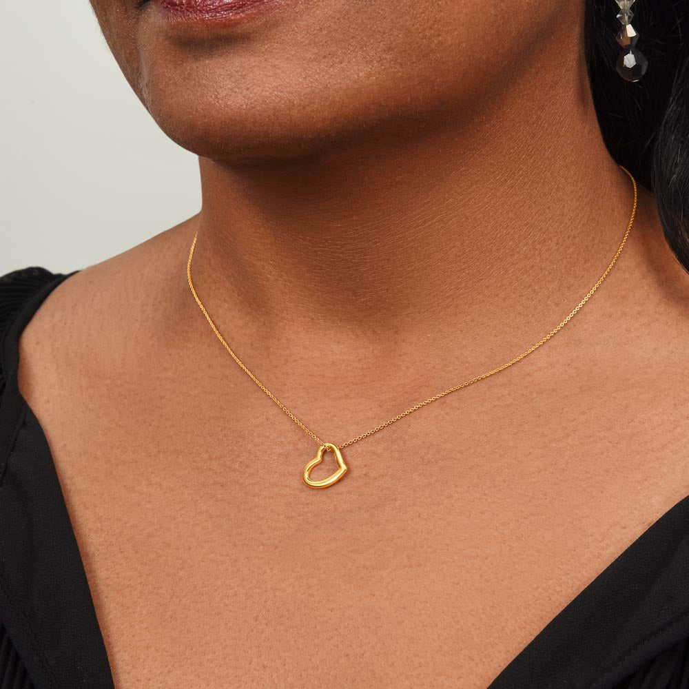 Girl wearing → daughter wearing heart necklace gift
